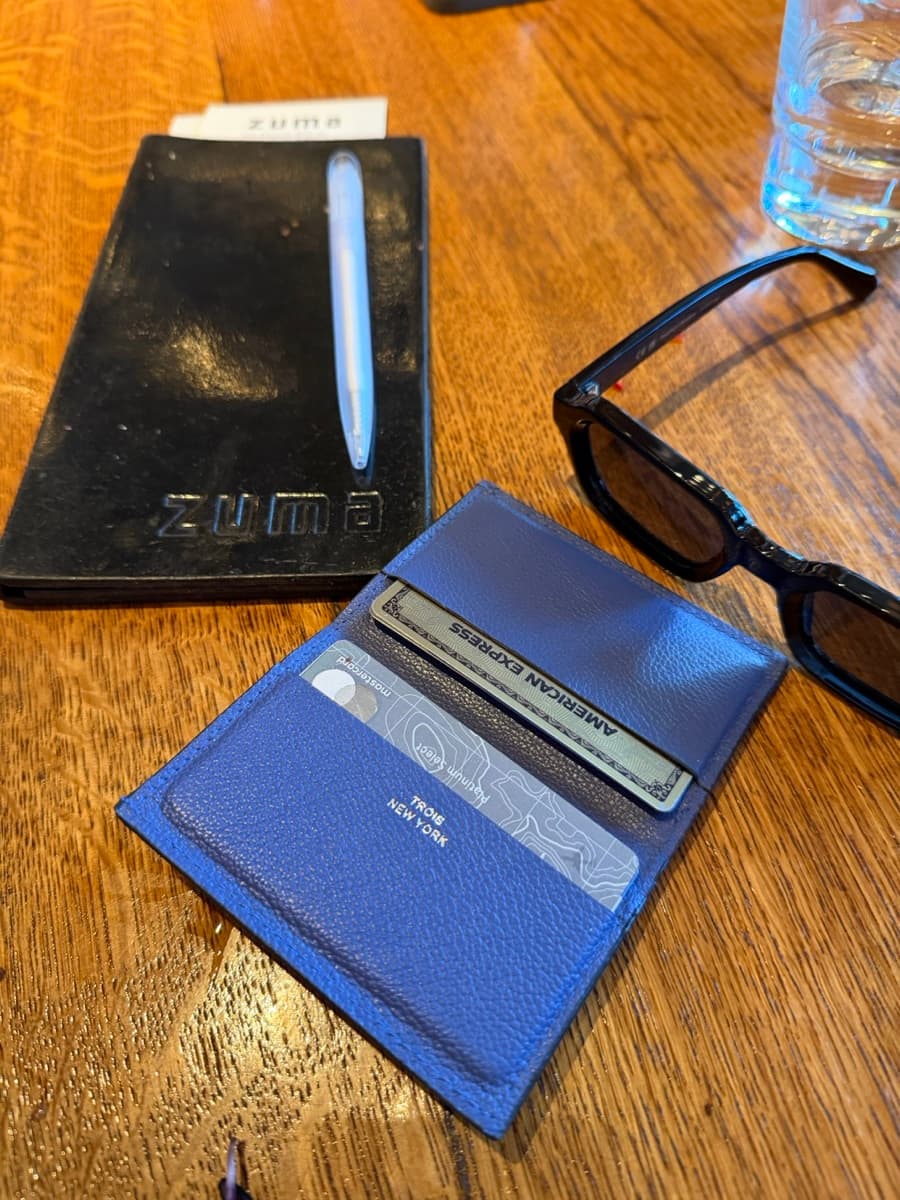 Trois wallet at dinner